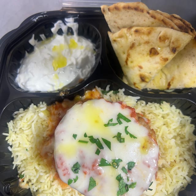 Baked Eggplant (Imam) Over Rice.